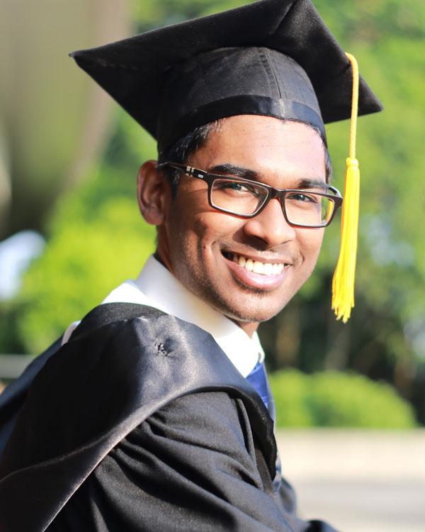 student-graduate Smiling student in graduation gown